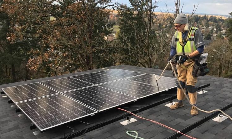 Climatize founder installing a solar array